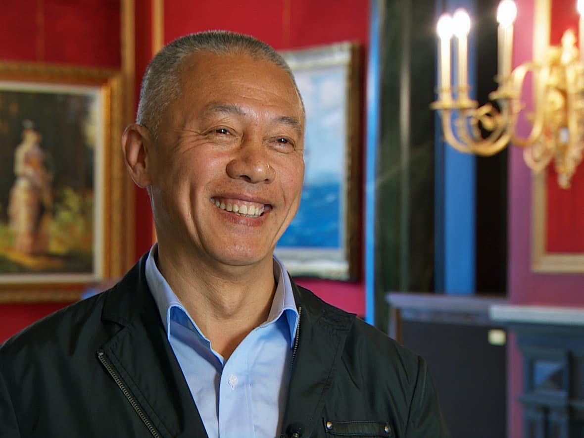 Billionaire Mingfei Zhao spoke with the CBC in 2016 about his plans to restore an iconic Vancouver mansion to its former glory. The Canada Revenue Agency has applied for an order to seize money from the sale of the home. (Chris Corday/CBC - image credit)