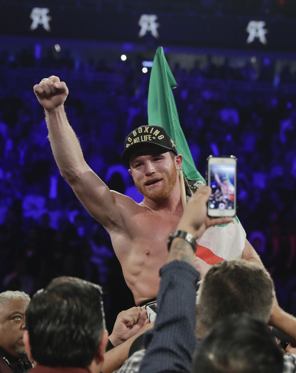 Canelo Alvarez celebrates after defeating Gennady Golovkin by majority decision in a middleweight title boxing match, Saturday, Sept. 15, 2018, in Las Vegas. (AP Photo/Isaac Brekken)