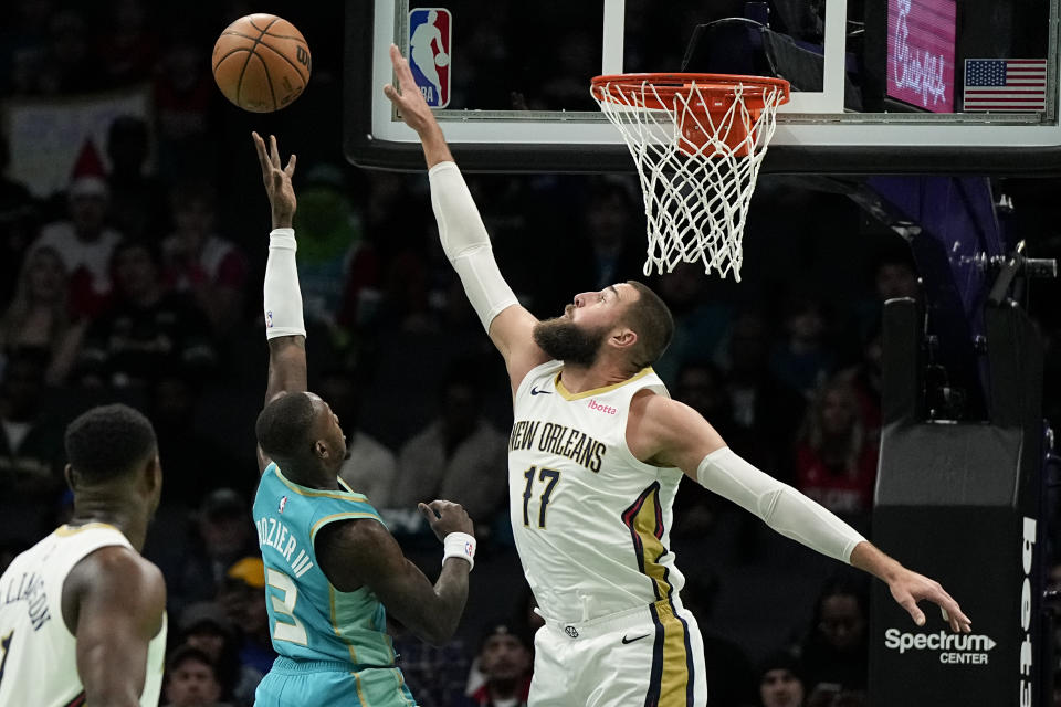 Charlotte Hornets guard Terry Rozier shoots over New Orleans Pelicans center Jonas Valanciunas during the first half of an NBA basketball game Friday, Dec. 15, 2023, in Charlotte, N.C. (AP Photo/Chris Carlson)