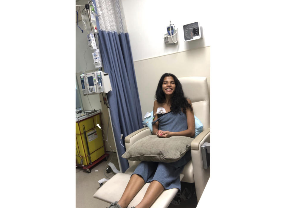 This photo provided by Asha Kamta shows Roshni Kamta undergoing cancer treatment on May 22, 2019 in New York. Fertility preservation was not something Kamta had planned for. But an unexpected breast cancer diagnosis changed everything. After some quick decisions, she found herself preparing to undergo an egg retrieval procedure days before embarking on cancer treatments. (Asha Kamta via AP)