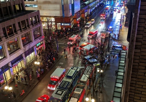 Police activity is seen at the scene of a shooting in downtown Seattle which left one dead and six injured January 22, 2020, in this picture posted to Twitter by a bystander