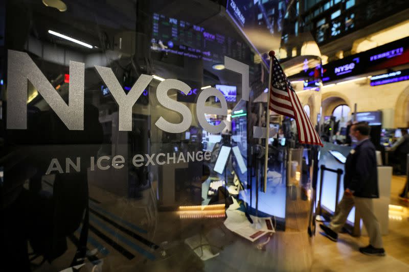 Traders work on the floor of the NYSE in New York