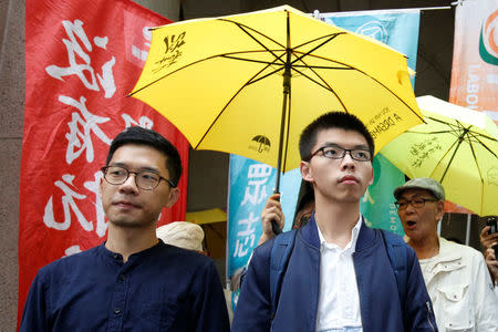 Pro-democracy activists Joshua Wong (R) and Nathan Law arrive at the Court of Final Appeal in Hong Kong, China November 7, 2017. REUTERS/Bobby Yip