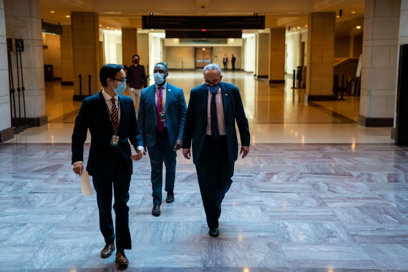 WASHINGTON, DC - FEBRUARY 25: Senate Majority Leader Chuck Schumer (D-NY) leaves a press conference, ahead of House passage of H.R. 5 - the Equality Act, on Capitol Hill on Thursday, Feb. 25, 2021 in Washington, DC. (Kent Nishimura / Los Angeles Times)