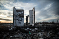 <p>A Pakistani migrant stands at the ruins of a building in an abandoned compond at the train station in Belgrade, Serbia, Feb. 2017 (Manu Brabo/MeMo) </p>