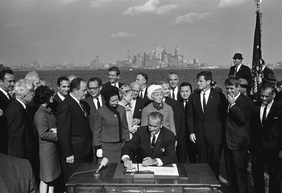 President Lyndon B. Johnson signs the Immigration and Nationality Act at Ellis Island. <a href="http://www.lbjlibrary.org/mediakits/immigration/p9.html" rel="nofollow noopener" target="_blank" data-ylk="slk:LBJ Library photo by Yoichi Okamoto;elm:context_link;itc:0;sec:content-canvas" class="link ">LBJ Library photo by Yoichi Okamoto</a>