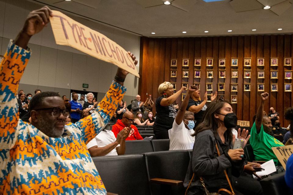 Audience members celebrate after an ordinance, which would have consolidated the previously passed ordinances on data transparency, traffic stops and more, was tabled indefinitely by Councilman JB Smiley during the Memphis City Council meeting on Tuesday, April 11, 2023. 