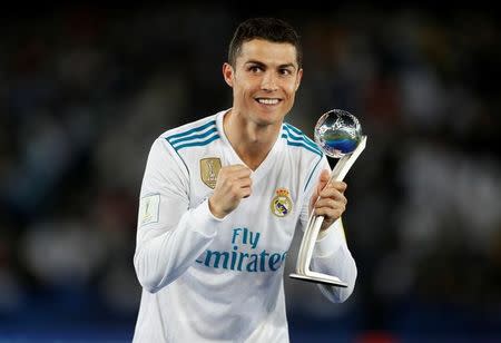 Soccer Football - FIFA Club World Cup Final - Real Madrid vs Gremio FBPA - Zayed Sports City Stadium, Abu Dhabi, United Arab Emirates - December 16, 2017 Real Madrid’s Cristiano Ronaldo celebrates with an award after the match REUTERS/Matthew Childs