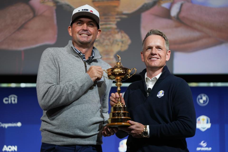 Oct 8, 2024; New York, New York, USA; US team captain Keegan Bradley, left, and Europe team captain Luke Donald take a photo with the Ryder Cup after a press conference at Times Center. Mandatory Credit: Lucas Boland-Imagn Images