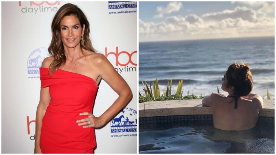 Cindy Crawford poses in a red dress and in a pool overlooking the water