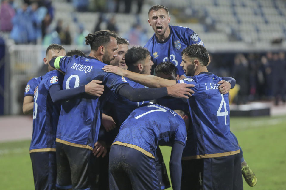 Kosovo players celebrate the opening goal during the Euro 2024 group I qualifying soccer match between Kosovo and Israel at the Fadil Vokrri stadium in Pristina, Kosovo, Sunday, Nov. 12, 2023. (AP Photo/Visar Kryeziu)