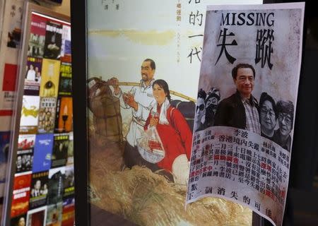 A printout showing Lee Bo, specializing in publications critical of China, and four other colleagues who went missing, is displayed outside a bookstore at Causeway Bay shopping district in Hong Kong, China January 6, 2016. REUTERS/Bobby Yip