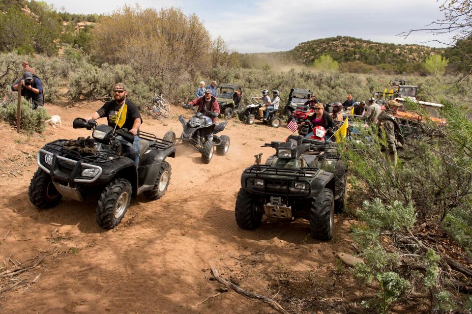 People ride ATVs into Recapture Canyon north of Blanding, Utah, in a 2014 protest against what demonstrators call the federal government’s overreaching control of public lands.