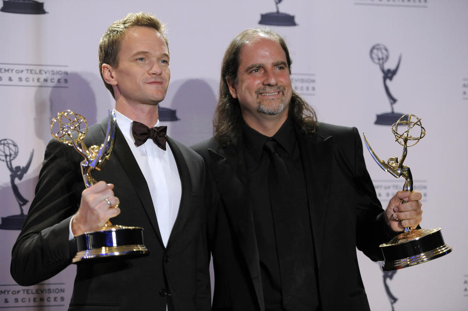 Neil Patrick Harris, left, and Glenn Weiss pose backstage with their awards for outstanding special class programs for the 65th Annual Tony Awards at the 2012 Creative Arts Emmys at the Nokia Theatre on Saturday, Sept. 15, 2012, in Los Angeles. (Photo by Chris Pizzello/Invision/AP)