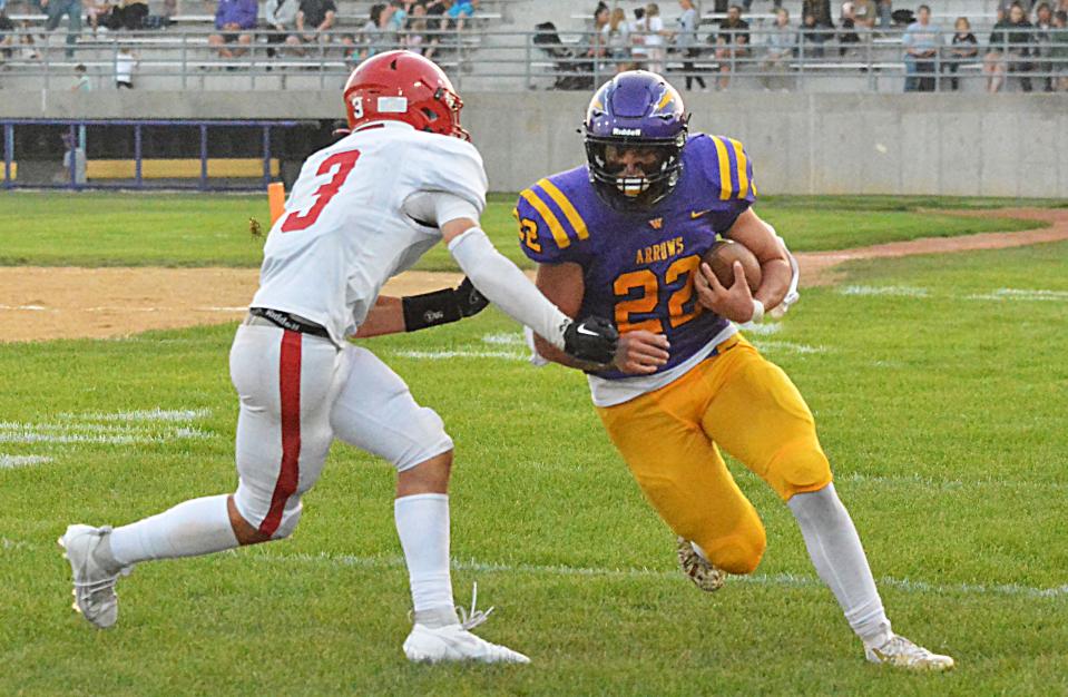 Watertown's Spencer Wientjes (22) turns upfield against Yankton's Easten Nelson after catching a pass during their Eastern South Dakota Conference football game on Friday, Sept. 8, 2023 at Watertown Stadium.