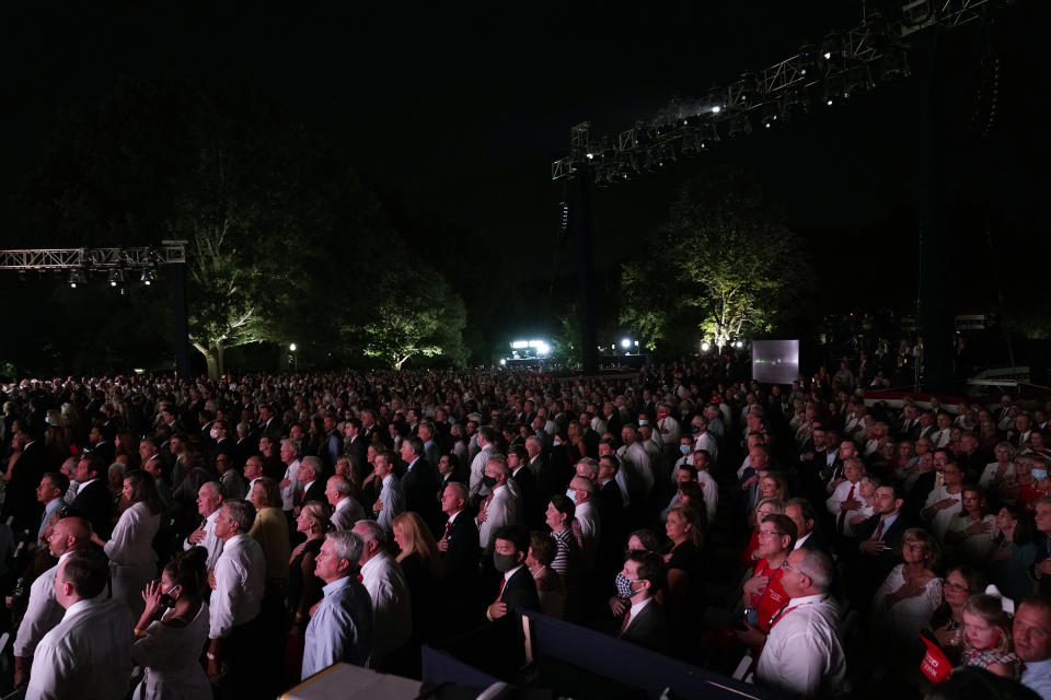 A crowd says the Pledge of Allegiance on the South Lawn of the White House on the fourth day of the Republican National Convention, Thursday, Aug. 27, 2020, in Washington. (AP Photo/Alex Brandon)