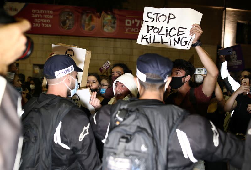 People take part in a demonstration against the aggression of Israeli forces against Palestinians, domestic violence, as well, to show solidarity with the Black Lives Matter movement, in Jerusalem