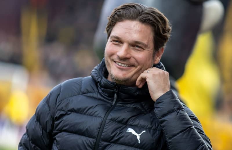 Borussia Dortmund coach Edin Terzic smiles before the start of the Bundesliga soccer match between FC Union Berlin and Borussia Dortmund. Terzic told reporters that midfielder Felix Nmecha and goalkeeper Gregor Kobel who have been out for months with injuries are both making significant progress. Andreas Gora/dpa