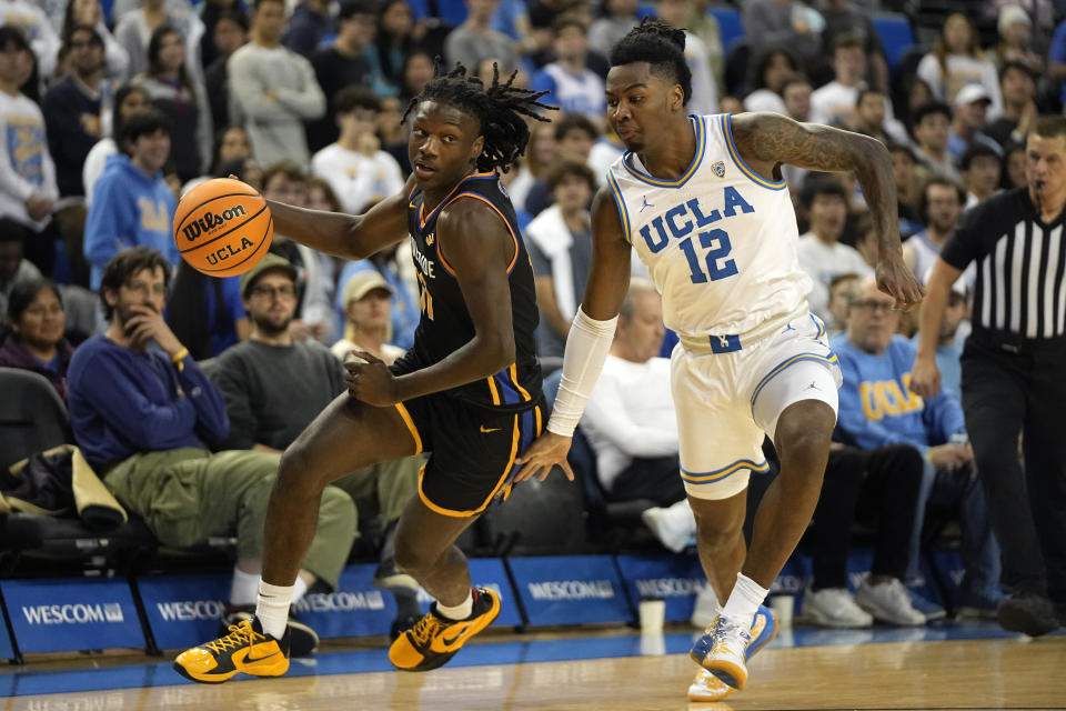 UC Riverside guard Nate Pickens, left, drives past UCLA guard Sebastian Mack during the first half of an NCAA college basketball game Thursday, Nov. 30, 2023, in Los Angeles. (AP Photo/Mark J. Terrill)