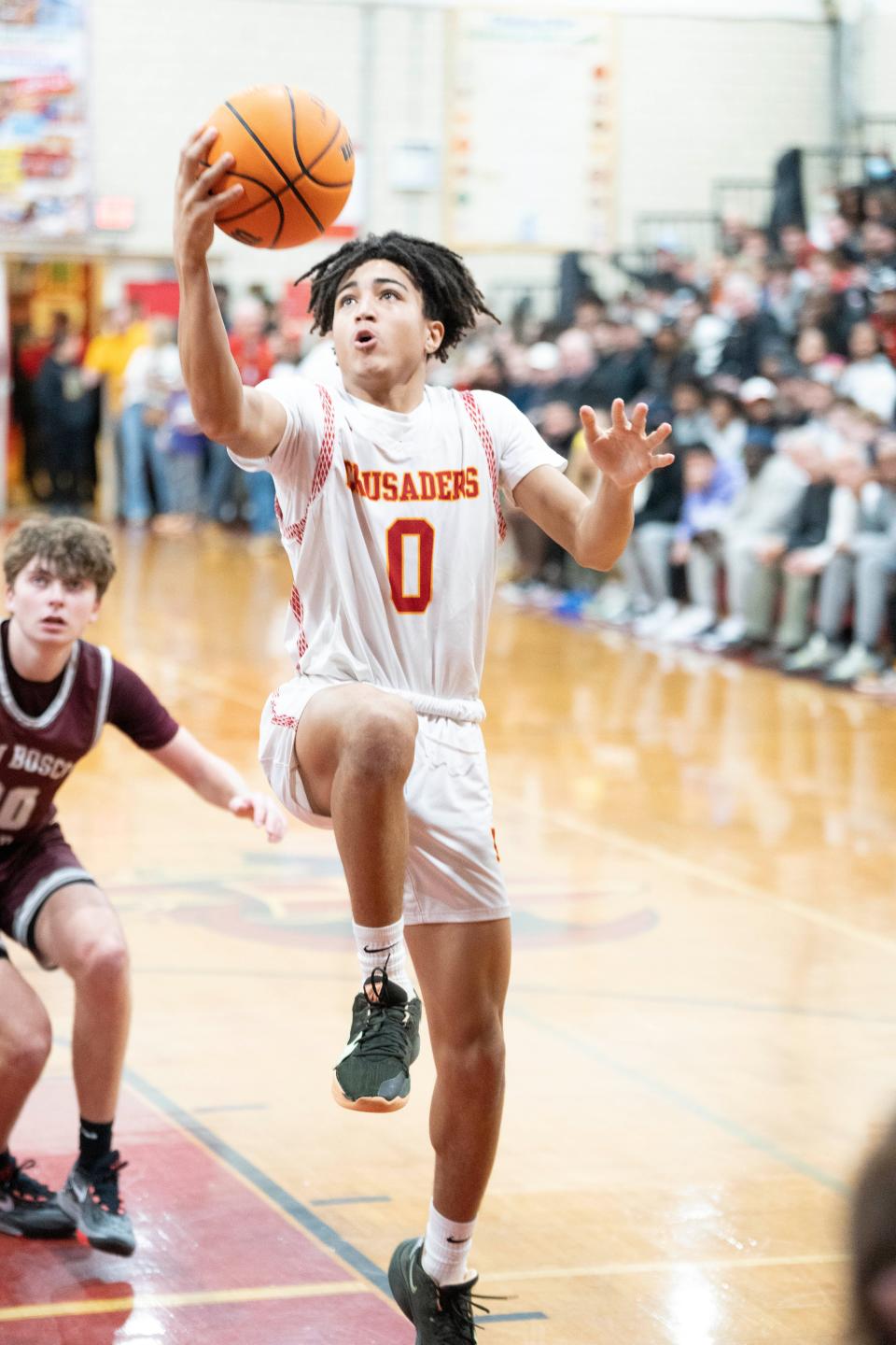 Don Bosco boys basketball at Bergen Catholic on Thursday, January 12, 2023. BC #0 Naiim Parrish drives to the basket.