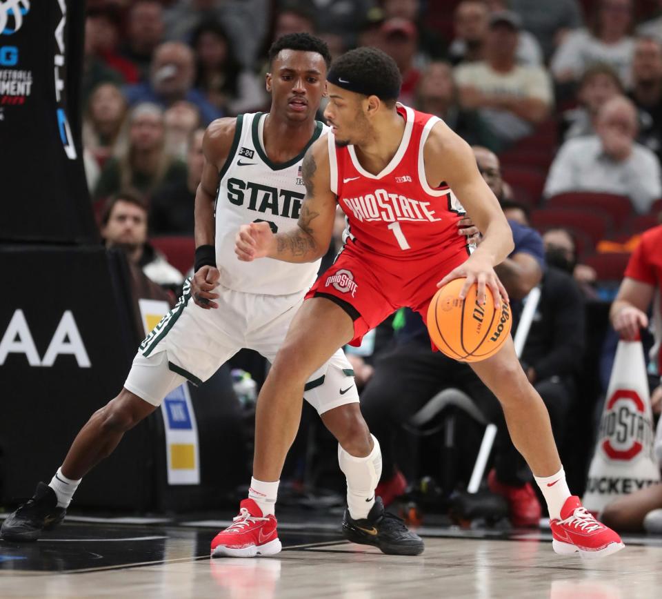 Michigan State Spartans guard Tyson Walker defends Ohio State Buckeyes guard Roddy Gayle Jr. during second-half action in the Big Ten tournament quarterfinals at United Center in Chicago on Friday, March 10, 2023.