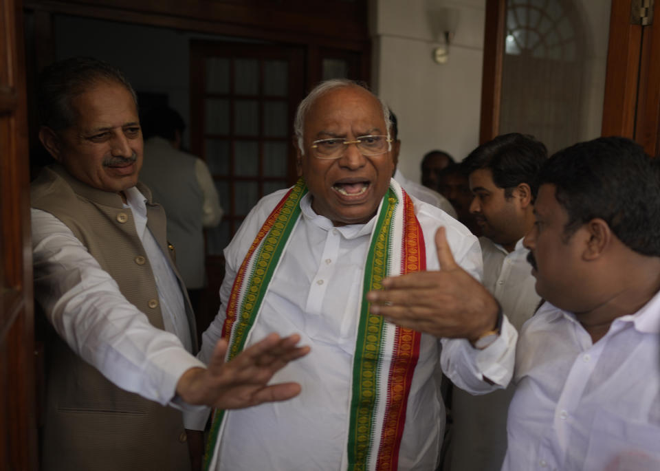 Newly elected president of India’s main opposition Congress party Mallikarjun Kharge, center, talks to his supporters after the election results, in New Delhi, India, Wednesday, Oct. 19, 2022. Kharge was elected new president in a contest in which the Nehru-Gandhi family, which has led the party for more than two decades, did not compete. (AP Photo/Manish Swarup)