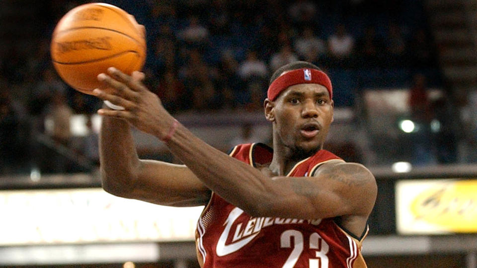 Mandatory Credit: Photo by Steve Yeater/AP/Shutterstock (6422315a)JAMES Cleveland Cavaliers guard LeBron James passes the ball off as he drives the lane against the Sacramento Kings during the second half at Arco Arena in Sacramento, Calif.