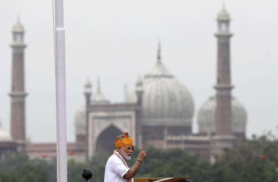 Indian Prime Minister Narendra Modi addresses to the nation on the country's Independence Day from the ramparts of the historical Red Fort in New Delhi, India, Thursday, Aug. 15, 2019. Modi said that stripping the disputed Kashmir region of its statehood and special constitutional provisions has helped unify the country. Modi gave the annual Independence Day address from the historic Red Fort in New Delhi as an unprecedented security lockdown kept people in Indian-administered Kashmir indoors for an eleventh day. In the background famous Jama Masjid or Mosque is seen. (AP Photo/Manish Swarup)
