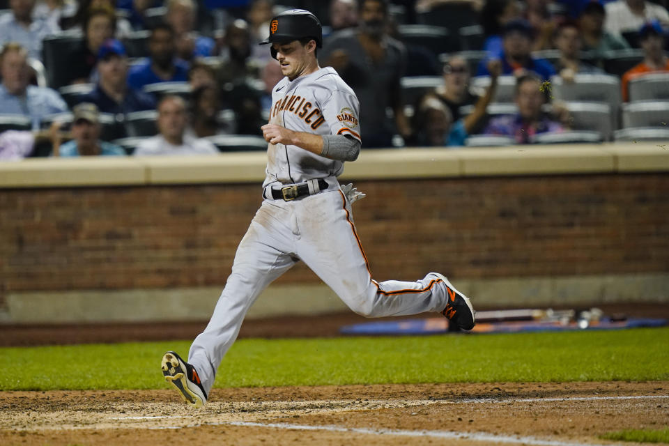 San Francisco Giants' Mike Yastrzemski scores on a single by Darin Ruf during the eighth inning of the team's baseball game against the New York Mets on Thursday, Aug. 26, 2021, in New York. (AP Photo/Frank Franklin II)