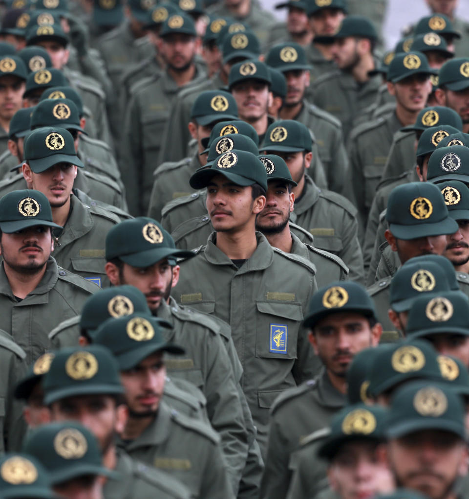 In this Feb. 11, 2019 file photo, Iranian Revolutionary Guard members attend a ceremony celebrating the 40th anniversary of the Islamic Revolution, at the Azadi, or Freedom, Square in Tehran, Iran. On Monday, April 8, 2019, the Trump administration designated Iran’s Revolutionary Guard a “foreign terrorist organization” in an unprecedented move against a national armed force. Iran’s Revolutionary Guard Corps went from being a domestic security force with origins in the 1979 Islamic Revolution to a transnational fighting force. (AP Photo/Vahid Salemi)