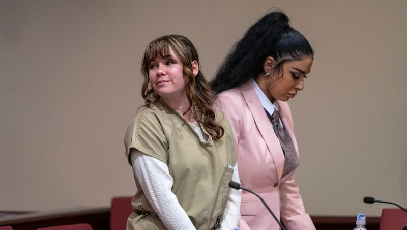 Hannah Gutierrez-Reed, left, and paralegal Carmella Sisneros await sentencing in state district court in Santa Fe, New Mexico, on Monday, April 15, 2024. Gutierrez-Reed, the armorer on the set of the Western film "Rust," was sentenced to 18 months in prison for involuntary manslaughter in the death of cinematographer Halyna Hutchins, who was fatally shot by Alec Baldwin in 2021.