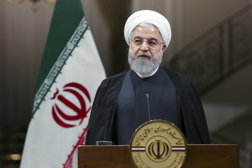 In this photo released by the official website of the office of the Iranian Presidency, Iranian President Hassan Rouhani speaks at a press conference with Pakistani Prime Minister Imran Khan at the Saadabad Palace, in Tehran, Iran, Sunday, Oct. 13, 2019. (Office of the Iranian Presidency via AP)