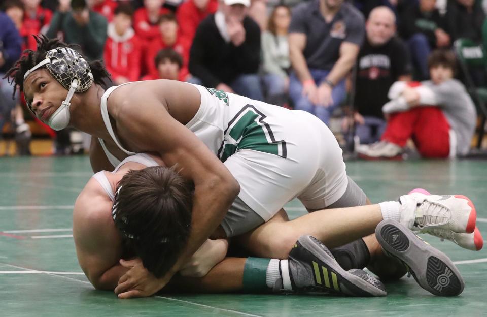 Nordonia's Israel Petite checks the clock as he handles Wadworth's Jack Dinwiddie during the championship match in 144 lbs. weight class at the 2024 Suburban League tournament at Highland High School in Medina on Saturday, Jan. 27, 2024. Nordonia's Petite won the match.