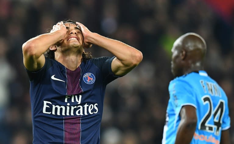 Paris Saint-Germain's Edinson Cavani reacts after missing an opportunity to score during their French Ligue 1 match against Marseille, at the Parc des Princes stadium in Paris, on October 23, 2016