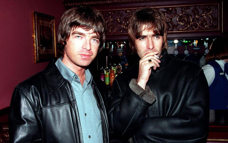 Noel and Liam Gallagher of Oasis epitomised the 1990s - Getty