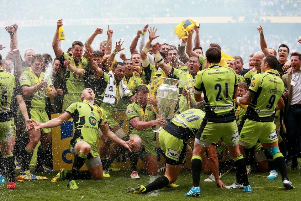 Northampton players celebrate winning the Premiership title in 2014 (David Davies/PA) (PA Archive)