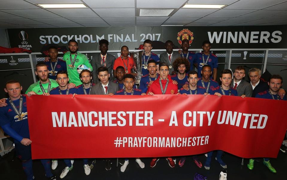 United players in front of a banner reading Manchester A City United - Credit: Getty Images