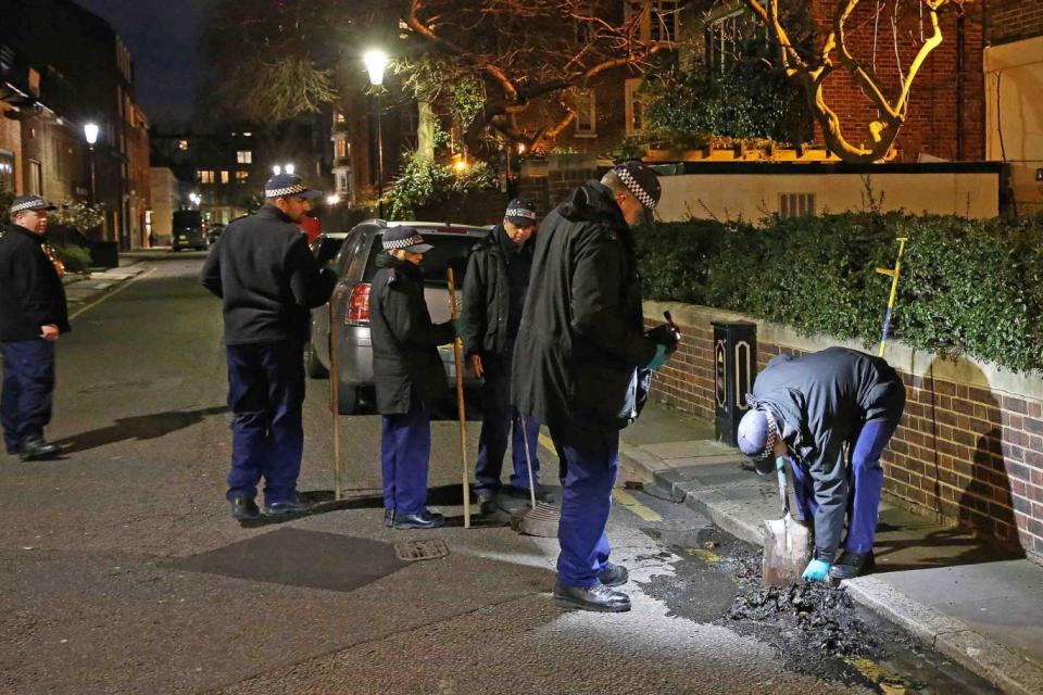 Specialist officers search drains in Logan Place (Nigel Howard)