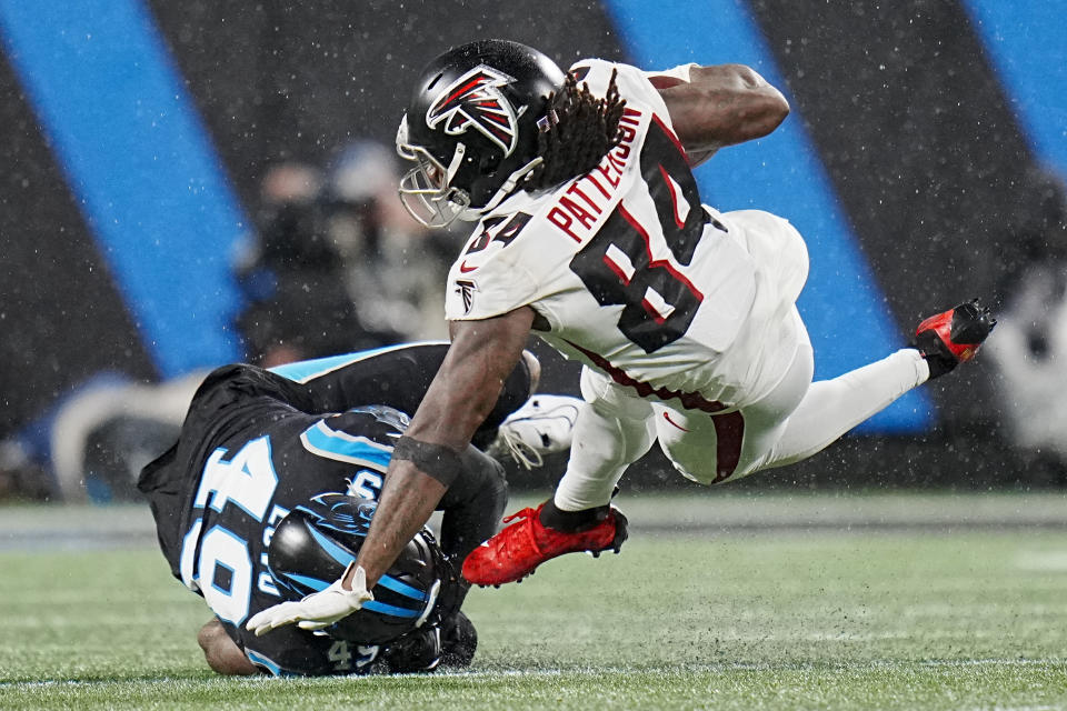 Atlanta Falcons running back Cordarrelle Patterson is tackled by Carolina Panthers linebacker Frankie Luvu during the second half of an NFL football game on Thursday, Nov. 10, 2022, in Charlotte, N.C. (AP Photo/Rusty Jones)