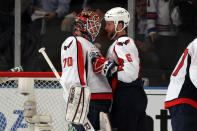 NEW YORK, NY - APRIL 30: Goalie Braden Holtby #70 and Dennis Wideman #6 of the Washington Capitals celebrate after they won 3-2 against the New York Rangers in Game Two of the Eastern Conference Semifinals during the 2012 NHL Stanley Cup Playoffs at Madison Square Garden on April 30, 2012 in New York City. (Photo by Bruce Bennett/Getty Images)