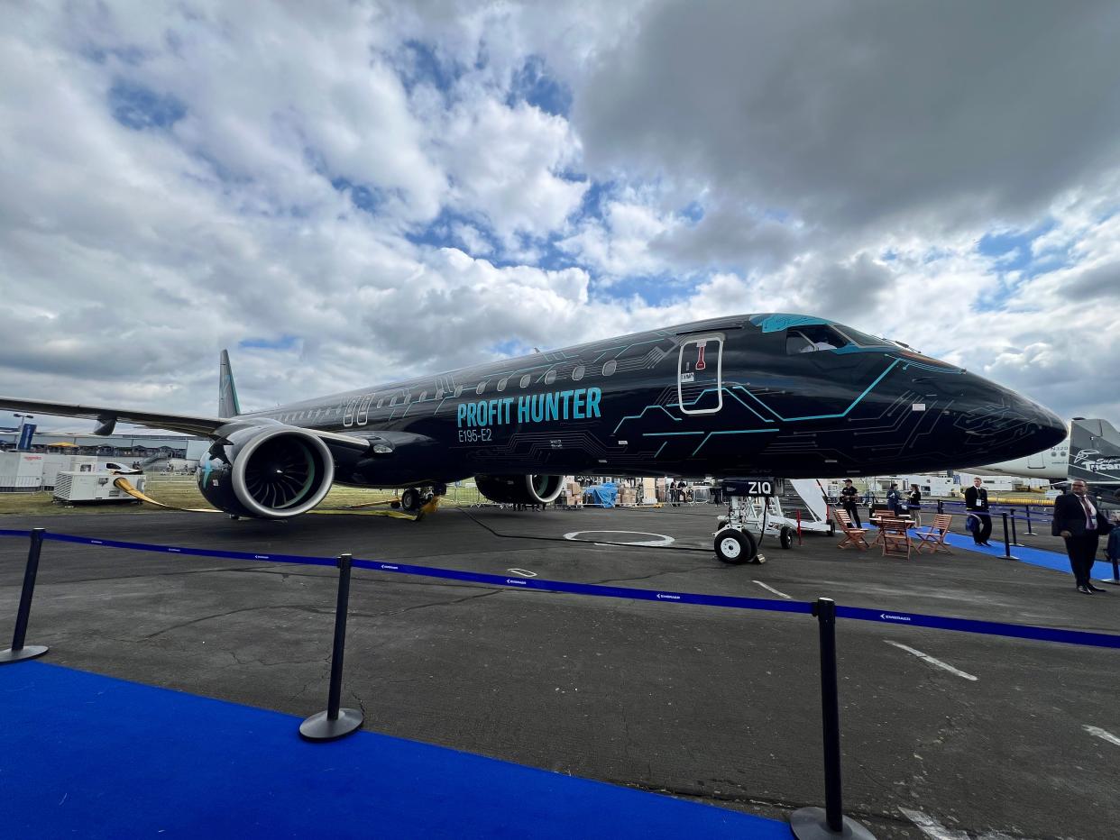 A side view of an Embraer E195-E2 at the 2024 Farnborough Airshow