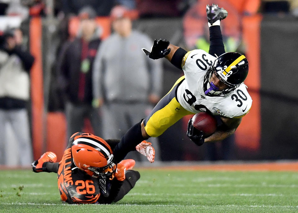 CLEVELAND, OHIO - NOVEMBER 14: Running back James Conner #30 of the Pittsburgh Steelers is tackled by cornerback Greedy Williams #26 of the Cleveland Browns  at FirstEnergy Stadium on November 14, 2019 in Cleveland, Ohio. (Photo by Jamie Sabau/Getty Images)