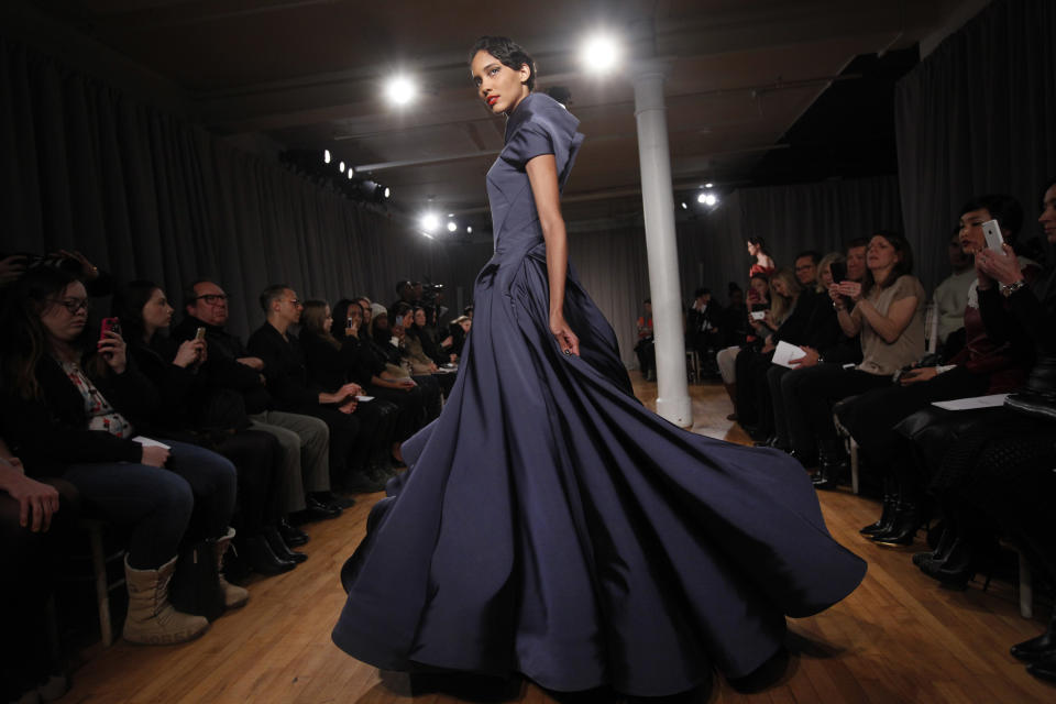 The Zac Posen Fall 2014 collection is modeled during Fashion Week in New York, Monday, Feb. 10, 2014. (AP Photo/Jason DeCrow)