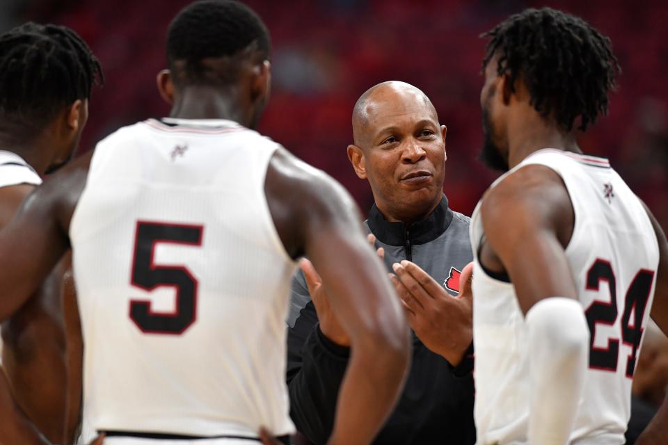 Louisville head coach Kenny Payne talks with his team during the second half of their exhibition game against Lenoir-Rhyne, Sunday, Oct. 30 2022 in Louisville Ky Lenoir Rhyne won 57-47.