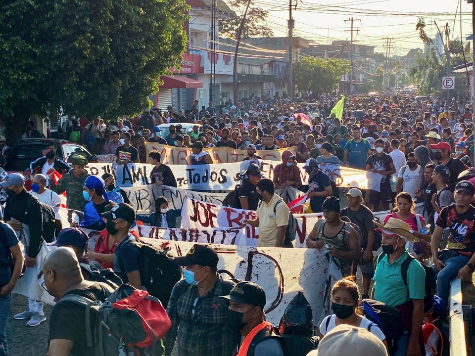 A caravan of migrants, most from central America, head north as they depart from Tapachula, Mexico, Saturday, Oct. 23, 2021. Immigration activists say they will lead migrants out of the southern Mexico city of Tapachula Saturday at the start of a march they hope will bring them to Mexico City to press their case for better treatment.