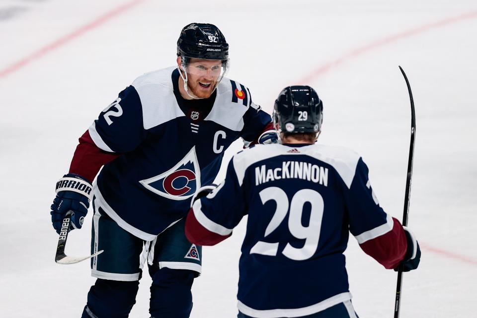 Colorado Avalanche left wing Gabriel Landeskog (92) celebrates his goal with center Nathan MacKinnon (29) earlier this season against the Minnesota Wild.