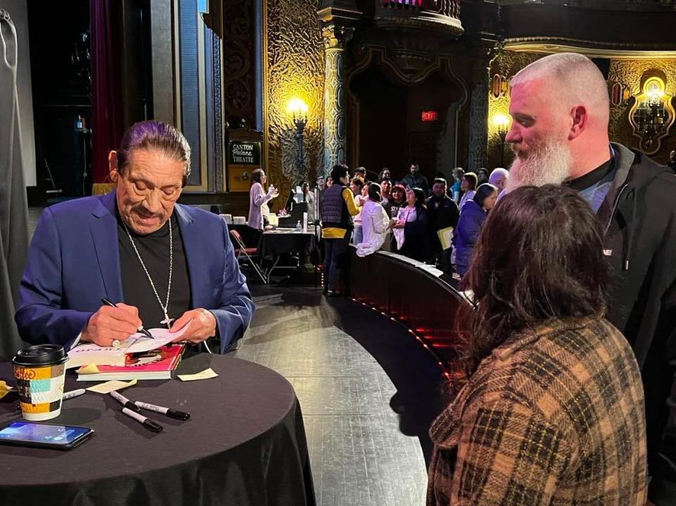 Actor Danny Trejo signs a book for fans following his Thursday night presentation at Canton Palace Theatre. Trejo's appearance was part of an event by Kent State University at Stark and Stark Library.
