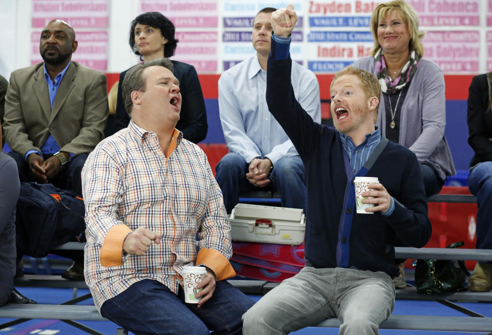 This TV publicity image released by ABC shows Eric Stonestreet, as Cameron, left, and Jesse Tyler Ferguson as Mitchell in a scene from the comedy "Modern Family." The ACLU is lobbying for the gay couple on “Modern Family” to get married. ACLU Action started a campaign to urge the show's producers to script a wedding episode for Mitchell and Cameron, already fathers of an adopted child and one of three couples at the heart of the show. (AP Photo/ABC, Jordin Althaus)