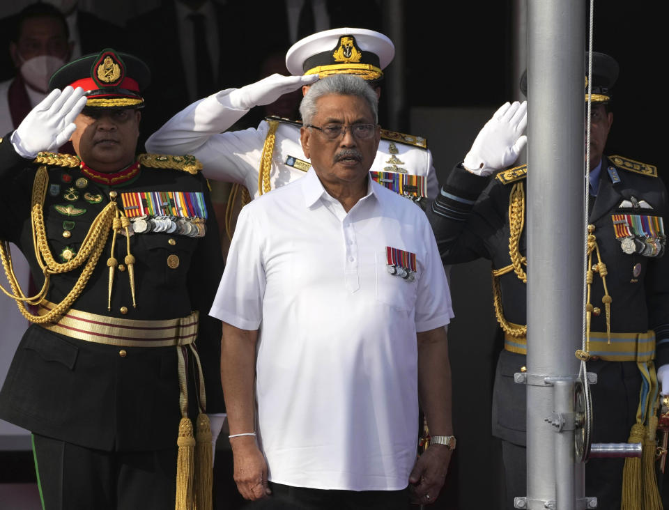 FILE- Sri Lankan President Gotabaya Rajapaksa sings the national anthem of Sri Lanka during the country's Independence Day celebration in Colombo, Sri Lanka, Feb. 4, 2022. The president of Sri Lanka fled the country early Wednesday, July 13, 2022, days after protesters stormed his home and office and the official residence of his prime minister amid a three-month economic crisis that triggered severe shortages of food and fuel.(AP Photo/Eranga Jayawardena, file)