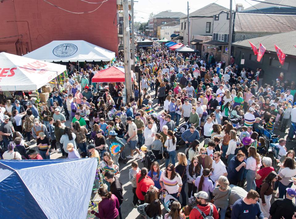 Crowds fill the streets of downtown Thibodaux for the inaugural Bayou King Cake Festival in Thibodaux on Saturday, Feb. 4, 2022.